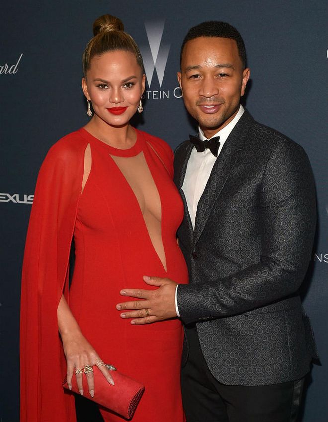 They say red is the colour of love, and Chrissy sure is showing lots of it in this caped Michael Kors number, especially with John Legend in tow.
