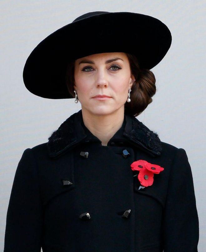 You'll likely never see the Queen in a neutral or a dark hue—her affinity for brights is actually another piece of royal protocol, since bright tones make it easy to spot her in a crowd. And while royals reserve black ensembles for funerals and evening gowns, the Queen instituted a rule that all members of the Royal Family must pack a black outfit whenever they travel, in case there is a sudden death while they're away, and a mourning look is required.
Photo: Getty