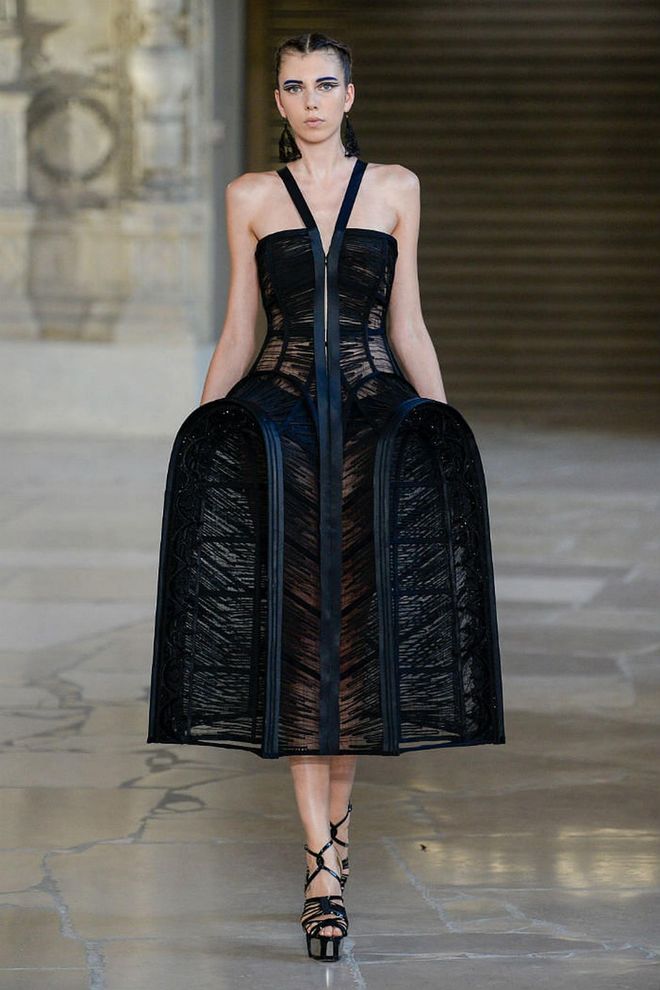 Chinese couturier Guo Pei looked to gothic churches and architecture for her Fall 2018 collection.

Interpreted as caged skirts, buttressed necklines, arched shoulders and geometric shapes, Pei's collection was one of ornate grandeur with a hint of edginess.