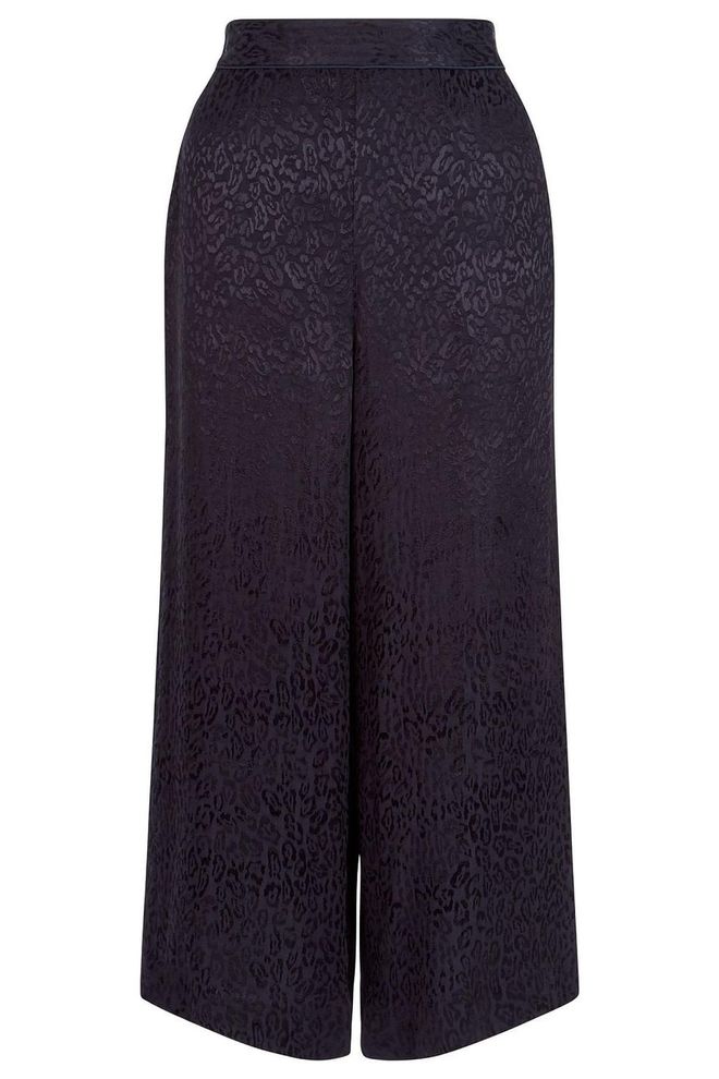 A pair of cropped pyjama trousers will work for day and night - style with trainers or backless loafers for day and with a pair of heels for the evening.
