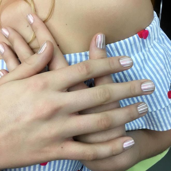 Dress-up a nude manicure with thinly-traced white stripes. Photo: @julieknailsnyc
