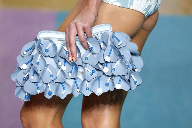 Seen at: Milan Fashion Week//Why we love it: This cute clutch combines the adorable colour of baby blue with gorgeous floral appliques, making this arm candy a definite conversation starter anywhere you go. (Photo: Getty)