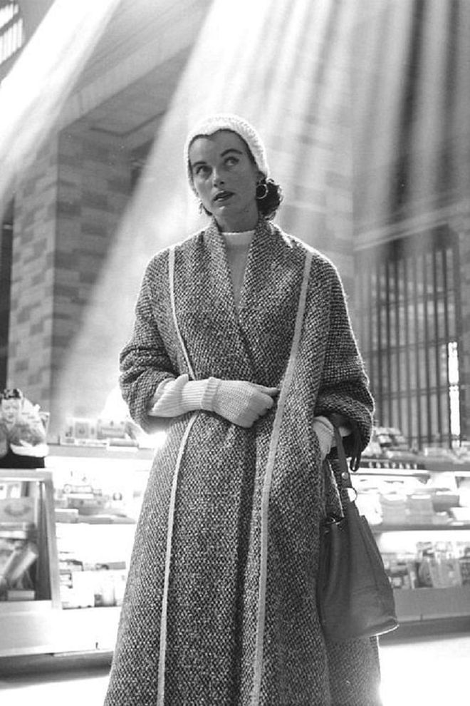 A model in tweed coat, knit gloves and cap in Grand Central Terminal, New York.