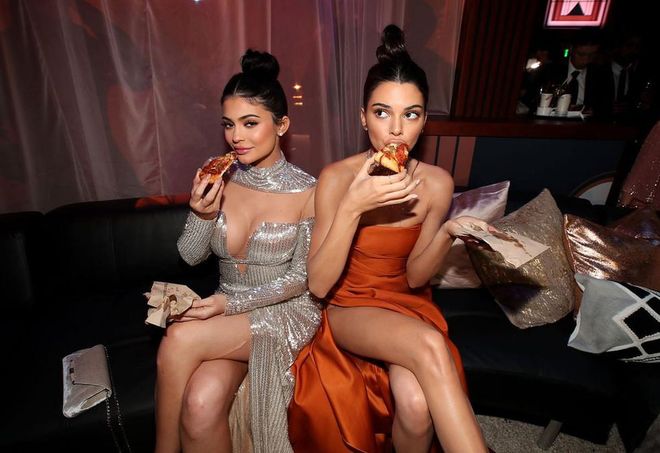 Are we sure Kendall and Kylie aren't sponsored by a pizza place? If not, Dominos should totally use this pic of the sisters from the 2017 Golden Globes in an upcoming ad campaign. Iconic. 
Photo: Getty