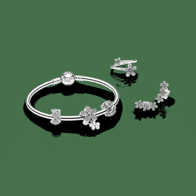 (From left) PANDORA Moments silver bangle, $129; Dazzling Daisies spacer, $69; 
Dazzling Daisy Duo Pendant charm, $149; Dazzling Daisies ring, $99; Dazzling Daisy Clusters stud earrings, $99