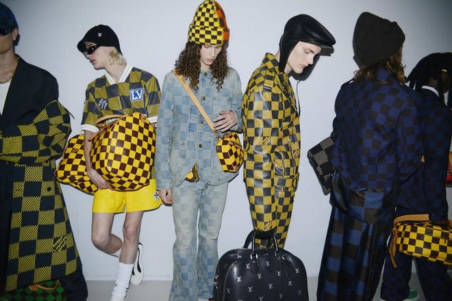 Backstage at the show, where models sported Williams’ new takes on the House codes, which include reinterpretations of the Damier check and luxe leather versions of the Speedy bag.