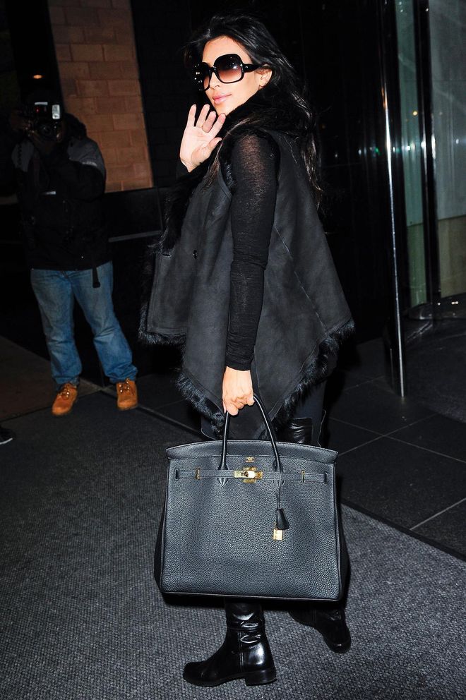 Long before Kourtney stepped out in a black Birkin, Kim wore it first in 2009. 
Photo: Getty