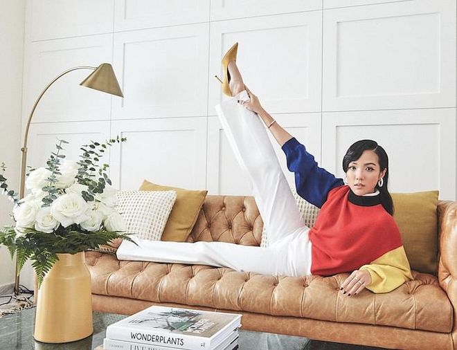 Cao flexing her style muscles in a wool sweater and cotton trousers from Hermès matched with her own jewellery and suede pumps.