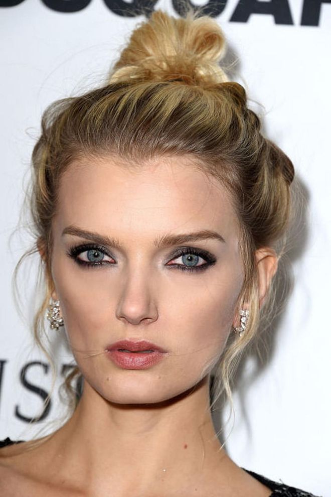 Lily Donaldson's gunmetal gray eye makeup is the epitome of holiday chic.
