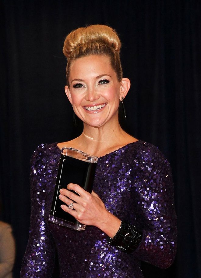 The Actress pulled her tresses back into a sleek glossy top knot. Photo: Getty