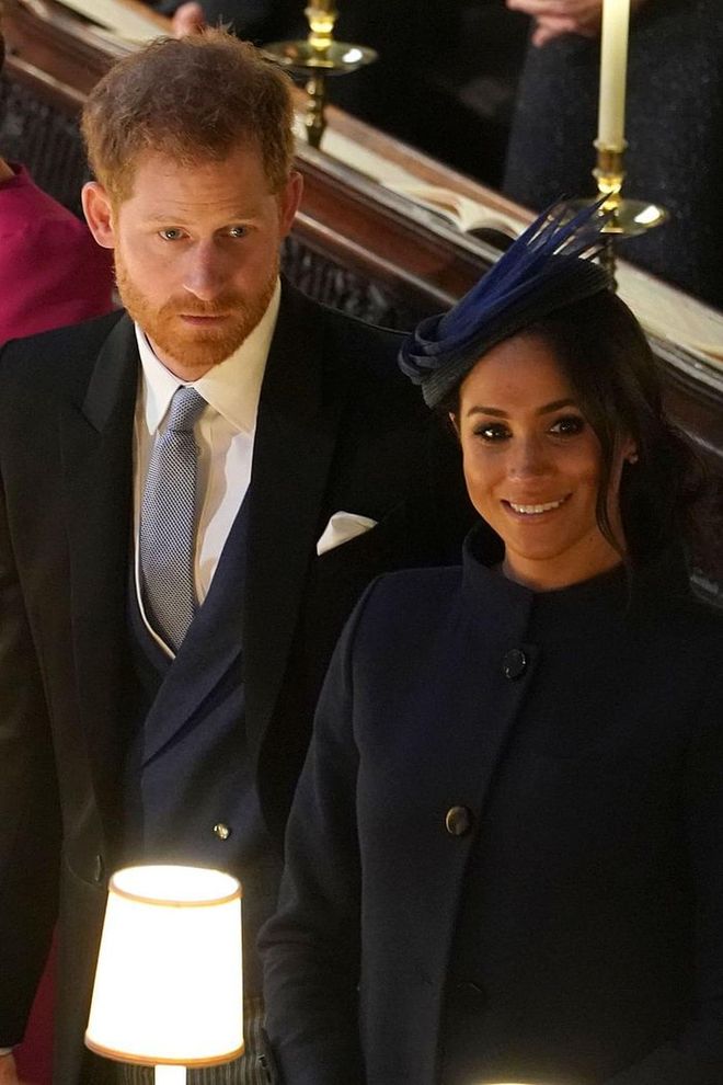 Prince Harry and Meghan Markle watching as their cousin walks down the aisle.