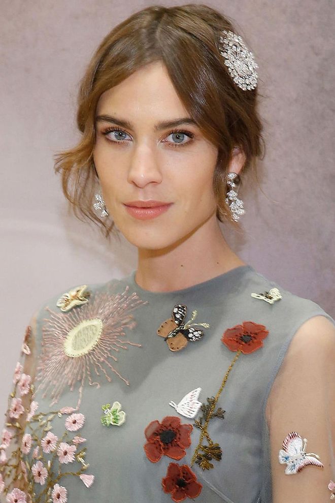 Alexa Chung makes the best of short lengths with some hair jewels and a center part that allows for even, draping tendrils to frame her face.