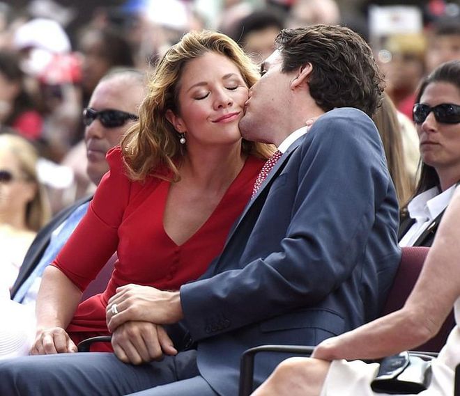 Kissing his wife on the cheek during the Canada Day noon hour entertainment. Photo: Getty 