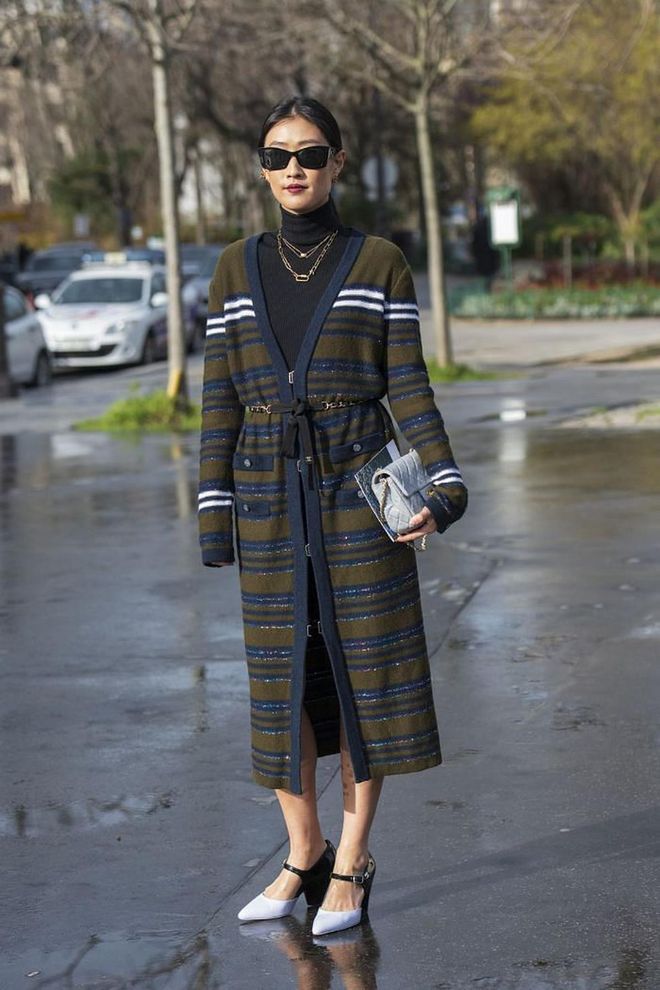 While cardigans might be an obvious choice for the office, trade in the more traditional approach by going for a calf-length midi style that can double as a dress. You can always temper the loose fit with a wide belt.

Photo: Kirstin Sinclair / Getty