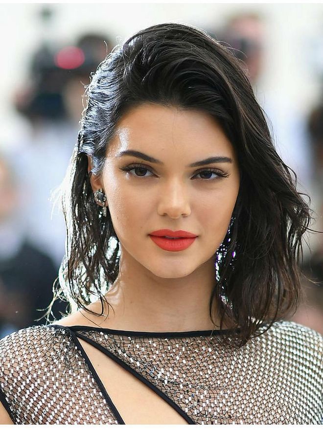 Wet-look waves and a red lipstick on the Met Gala red carpet in 2017. Photo: Getty 