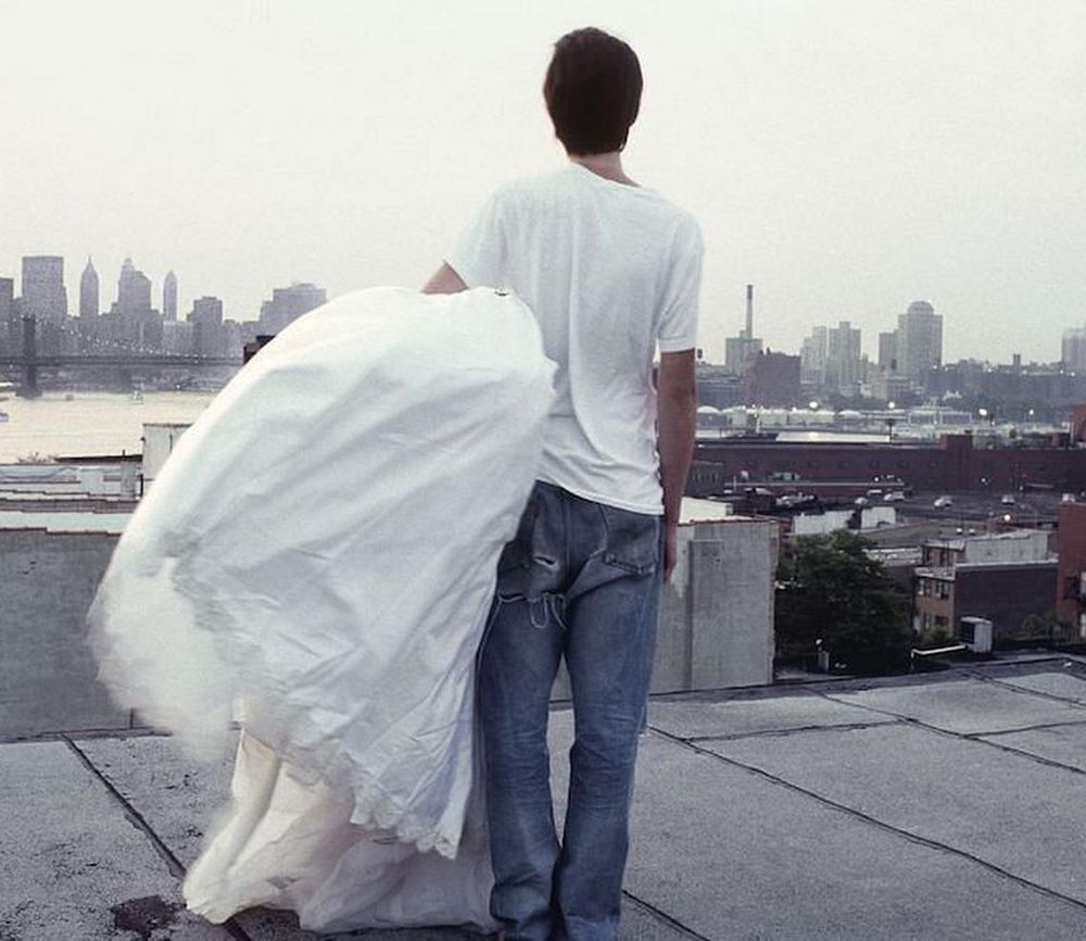 A Zero + Maria Cornejo wedding dress with the World Trade Center in the distance, 1999. (Photo: Mark Borthwick)
