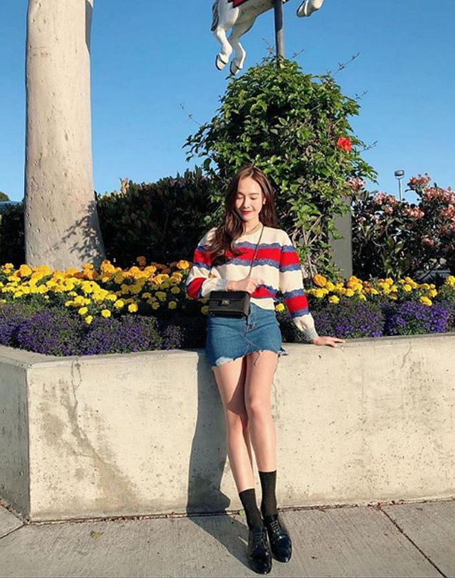 Jung channels Françoise Hardy in an oversized striped top, denim miniskirt, socks and oxfords. 
Photo: Instagram