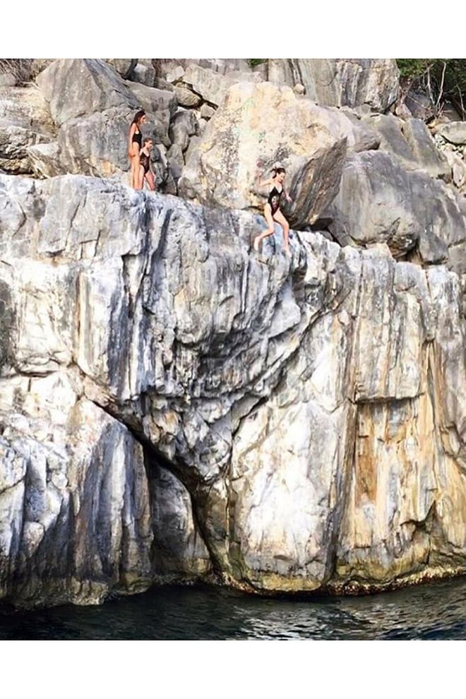 The model shared a series of vacation photos from an island getaway which included cliff-jumping, plenty of tiny bikinis and more. Photo: Instagram