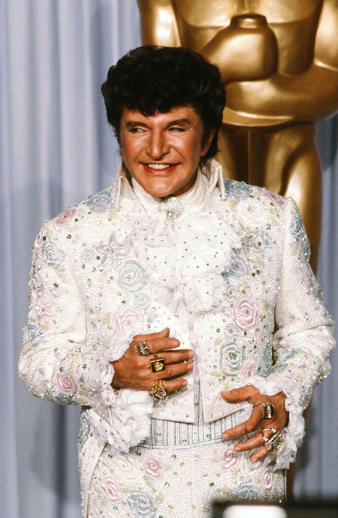 Proving sparkles are not just for women, legendary pianist Liberace is best remembered for his flashy costumes. Photo: Getty 
