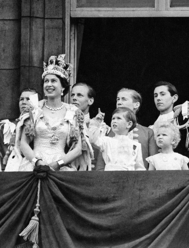 Prince Charles and Princess Anne were front and center at Queen Elizabeth's coronation in 1953. Here are the young royals on the Buckingham Palace balcony watching the royal air force flyover.
Photo: Getty
