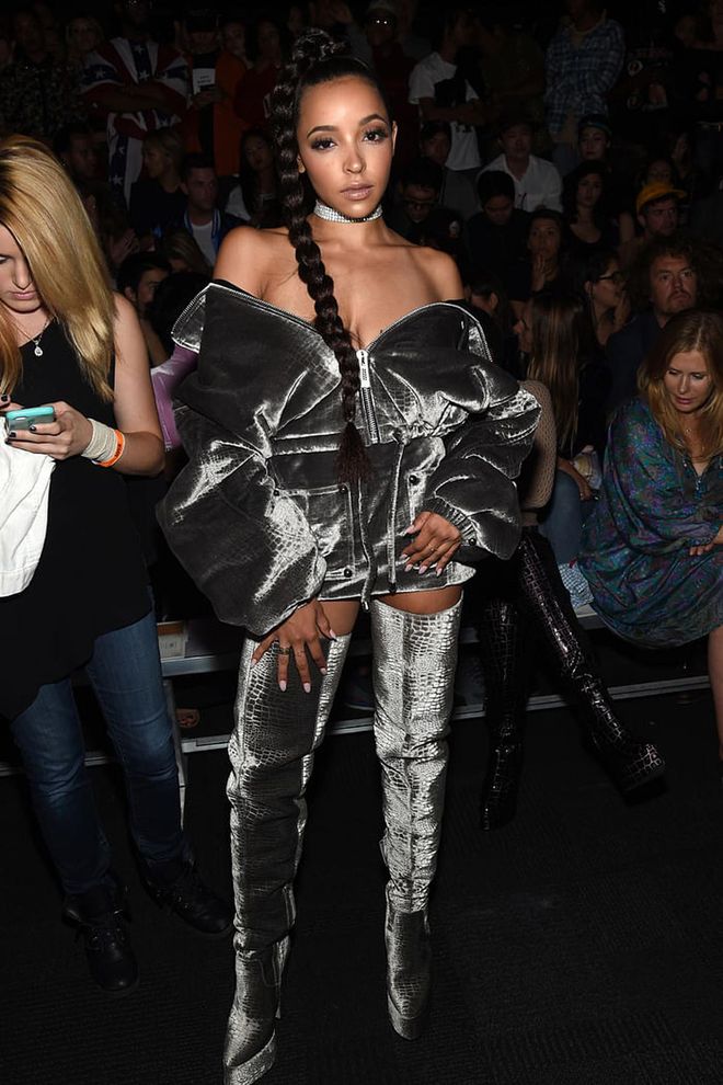 Tinashe wears a grey crocodile embossed off shoulder and thigh high boots—in velvet, no less. Photo: Getty