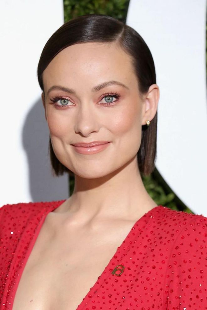 Short hair is all about showing off your face, so lean into it like Olivia Wilde by styling a short bob pin-straight and then tucking it behind the ears.

Photo: Getty