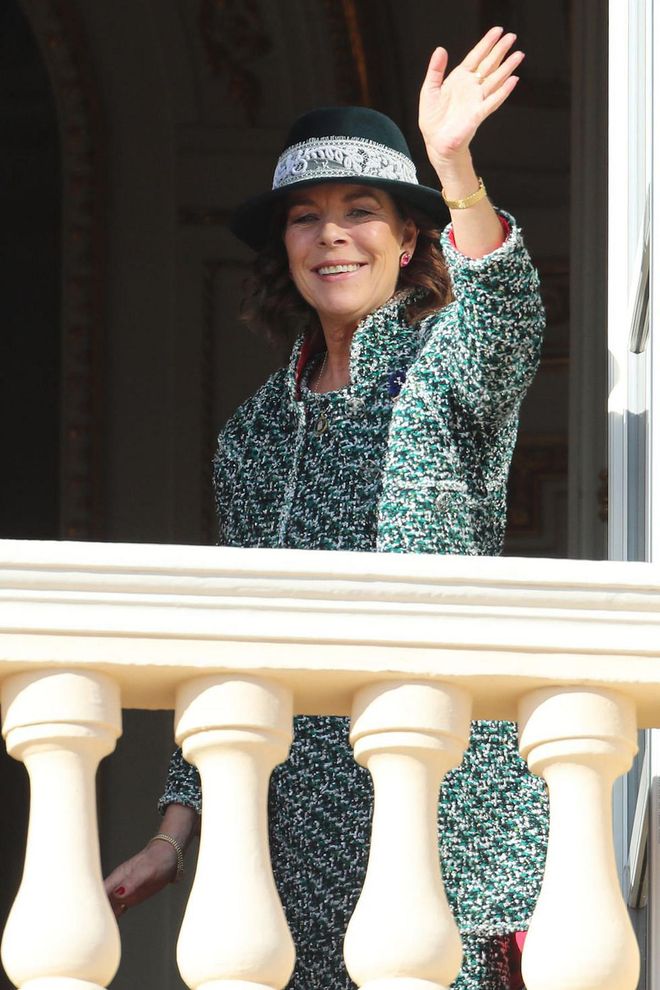 Princess Caroline of Hanover looks elegant in a green tweed suit and dark green hat with lace trim.