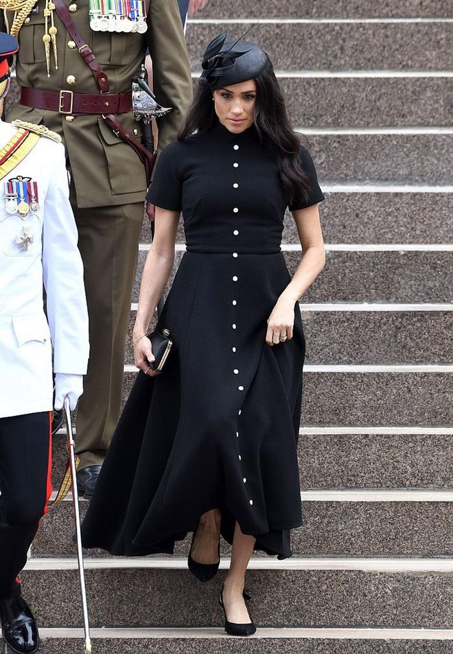 The Duchess visited the Anzac Memorial in Sydney's Hyde Park wearing a custom black  Emilia Wickstead and a matching Philip Treacy fascinator. Meghan also wore her much loved Givenchy satin clutch. 