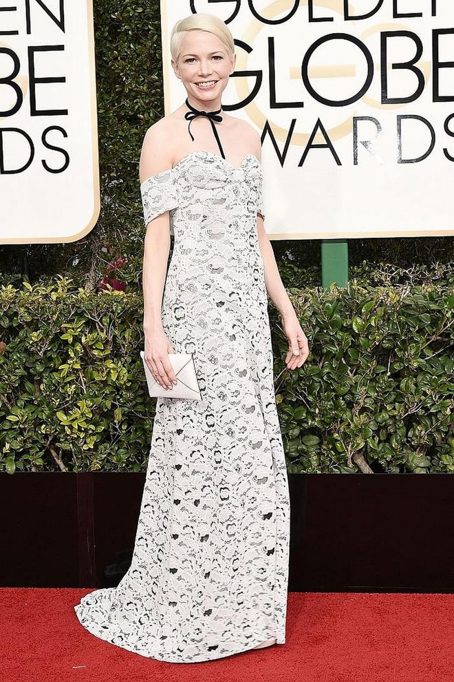 Michelle Williams' Louis Vuitton off-the-shoulder ivory lace gown paired with a sweet black ribbon choker was equal parts daring and darling. 