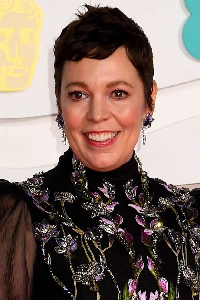 Olivia Colman always favours soft, glowing skin; this time teaming it with a little eyeliner and warm pink lipstick.

Photo: Getty