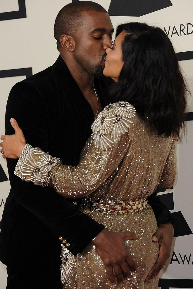 Kanye West isn’t shy about his admiration for Kim’s body (see: any of his recent music videos), and the couple rarely scale it back in photographs. During the 57th Annual Grammy Awards in 2015, Kanye and Kim went in for a (touchy) kiss. Photo: Getty