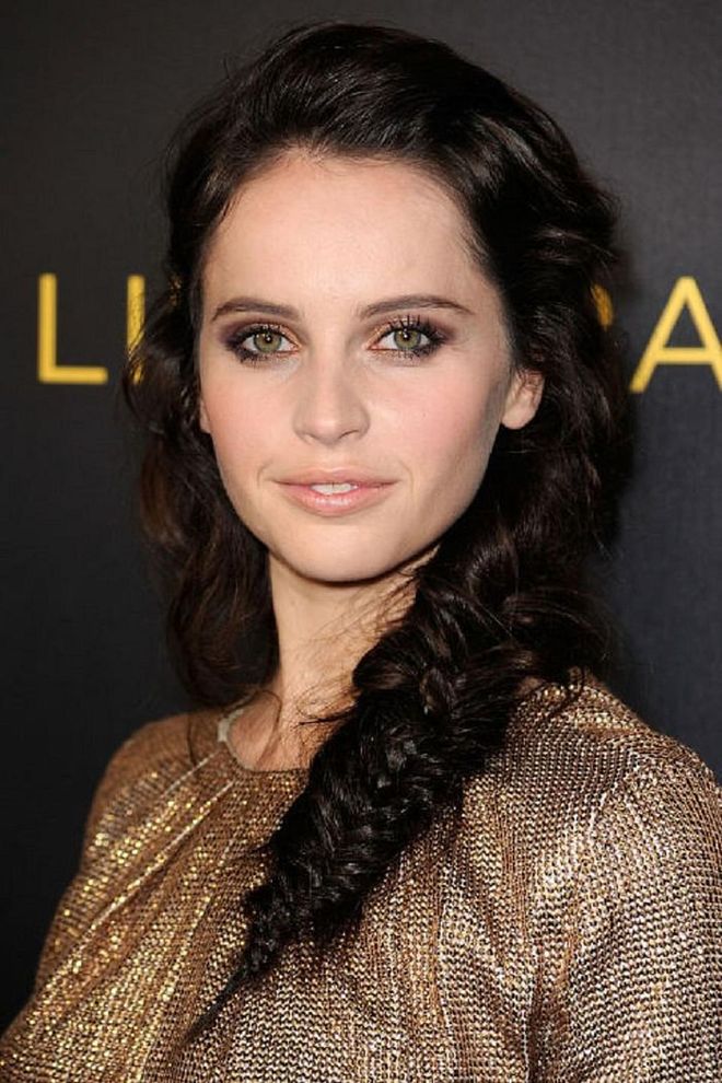 Felicity Jones replicated the classic dishevelled fishtail braid back in 2011. Recreate this style for everything from a gym class to the office or a special event; it will look incredible on those with thick, long hair. Photo: Getty