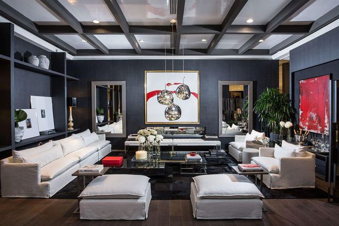 Touches of red and lace accents line Mirtha's living space of black, white and cool grays. With contemporary art additions and sleekly shaped furniture, the room epitomizes Valentino's bold vibe.
