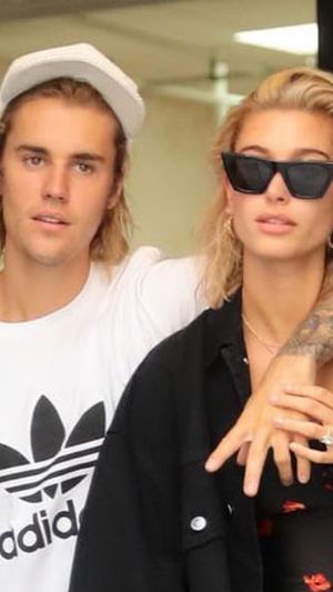 Hailey Bieber Lounges in a White Cami and Matching Thong with Her Name on It