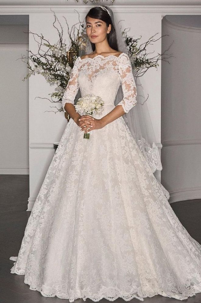 An all-lace gown with an off-shoulder neckline and three-quarter sleeve rather than a high neckline and a cap-sleeve would also achieve the overall classic yet modern feel that PIppa's gown did so effortlessly.

Legends by Romona Keveza gown, legendsromonakeveza.com