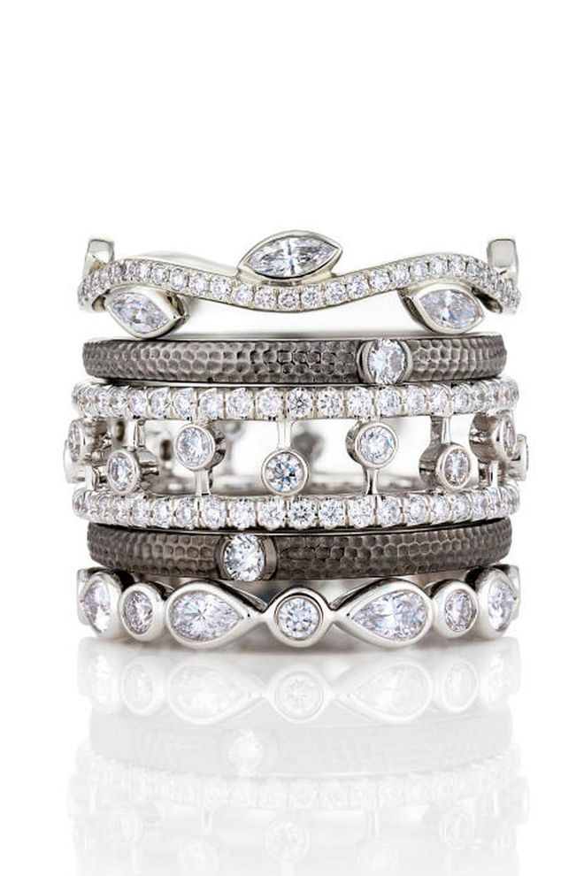 Stacking rings have grown in popularity over recent years. Choose gemstones or diamonds, the effect is the same: worn singularly they're a pretty accent but worn together they offer maximum impact. Plus, there's something fun in growing your collection.
Midnight sparkle stacks of sparkle ring collection. (From top to bottom) Adonis rose band, £3,325, Azulea one-diamond band, £625 (pictured twice), Dewdrop ring, £3,175, white gold petal band, £2,375, De Beers