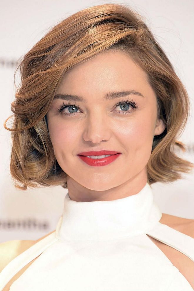 Miranda Kerr appears effortlessly polished while mastering fall's biggest trends: a jaw-dropping bob and a high neckline