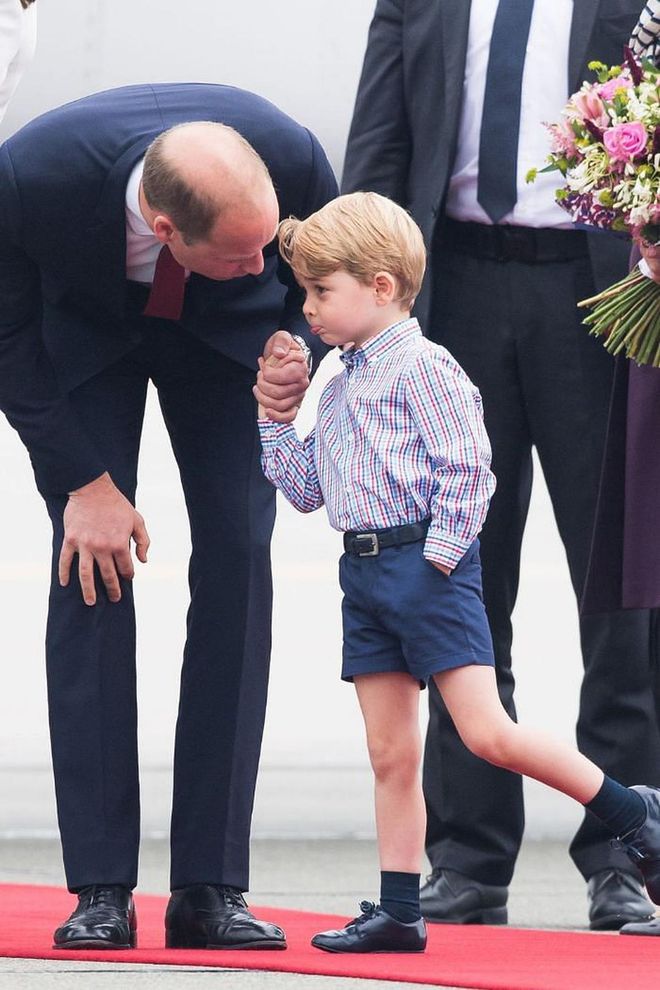 Prince William instructs Prince George before meeting government officials while arriving at the Warsaw airport for a royal visit to Poland in July 2017.

Photo: Getty
