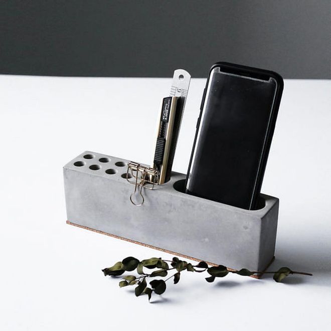 This simple yet tasteful Concrete desk organiser comes with 8 pen slots, 1 middle slot, and 1 large smartphone slot for all your office organisation needs. 