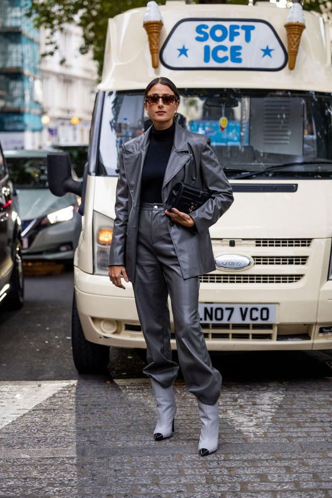LONDON, ENGLAND - SEPTEMBER 18: Julia Haghjoo wears grey blazer, pants, Chanel boots, black bag outside Erdem during London Fashion Week September 2022 on September 18, 2022 in London, England. (Photo by Christian Vierig/Getty Images)