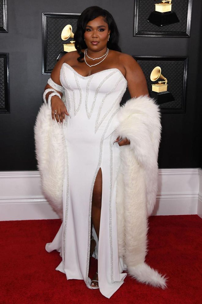 Lizzo brought plenty of glamour to the Grammys red carpet, opting for an old Hollywood-inspired look in the form of a white, strapless Versace gown, which she paired with Lorraine Schwartz diamonds, wavy locks and a dramatic fur stole. Photo: Getty