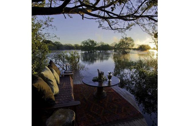 Explore Victoria Falls from the Zambezi River's only private island; Sindabezi is a luxury bush camp with five open-sided cottages set on the famous waterway. The eco-lodge looks out across the African bush, taking in the flood plains of the river and the nearby national park.