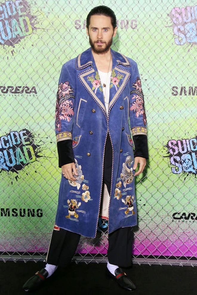 Jared Leto sports a Gucci embroidered blue coat and loafers with black slacks, a white shirt and layered necklaces at the Suicide Squad world premiere.Photo: Getty
