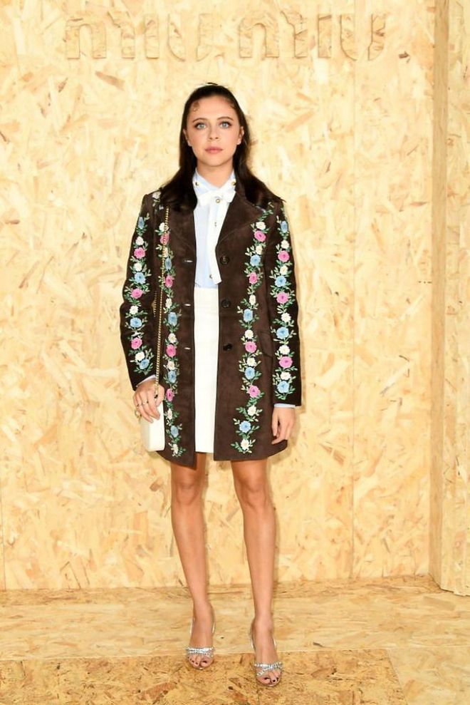 Bel Powley wore an embroidered statement coat with a white mini skirt and silver heels.

Photo: Getty