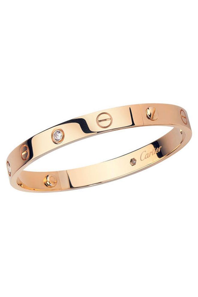 The Love bangle is one of the most searched for pieces of jewellery on Google, and with good reason; it is an easy-to-wear classic. Designed by Cartier in the 1970s, the bangle design is studded with screws which lock it to the wrist and is intended to signify the permanency of true love.
Pink gold Love bracelet, £4,600, Cartier