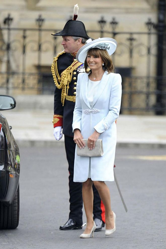 The bride's mother, Carole Middleton, shows off a Catherine Walker wool crepe coatdress and silk shantung day dress. Her hat is by milliner Jane Corbett.

Photo: Getty