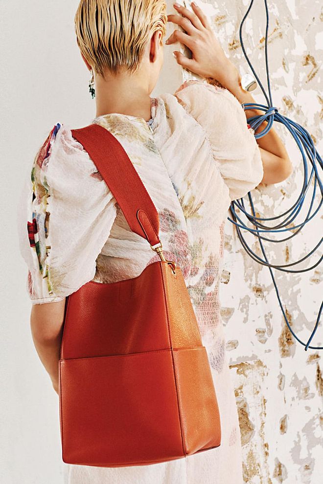 Flower Painted Polyester dress; Dinosaur earring; Cinnamon Soft Grained Calfskin Sangle bag, Céline 