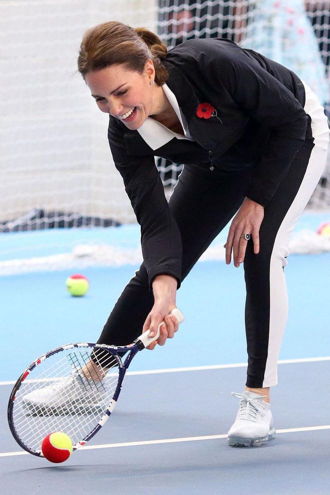While visiting the Lawn Tennis Association at the National Tennis Centre, Duchess Kate jumps in for a game.
Photo: Getty