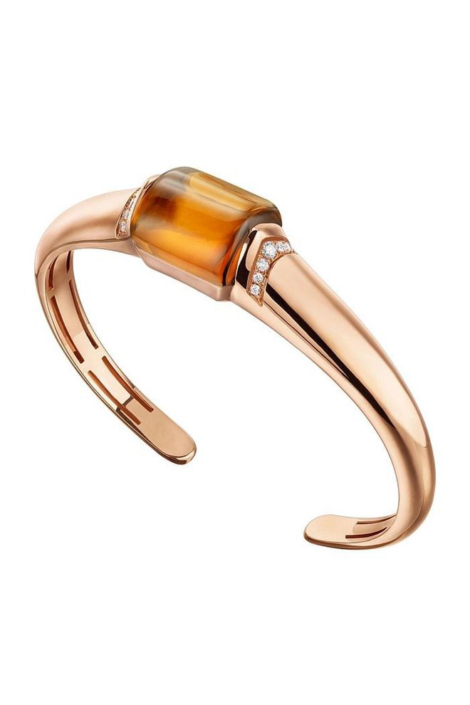 Who said your bracelets and bangles can't be as beautiful as your rings? This Bulgari bangle includes a statement citrine stone and pavé diamonds for added interest. 