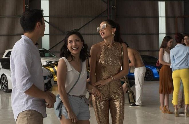 Model Araminta Lee (played by Japanese-British actress Sonoya Mizuno) makes a mark in this gold sequin jumpsuit. A colour that symbolizes wealth and power, this is quite the outfit. Araminta is a little bit loud and brash, and it suits her character perfectly as she shepherds friends to her bachelorette party — on a private island, might we add.